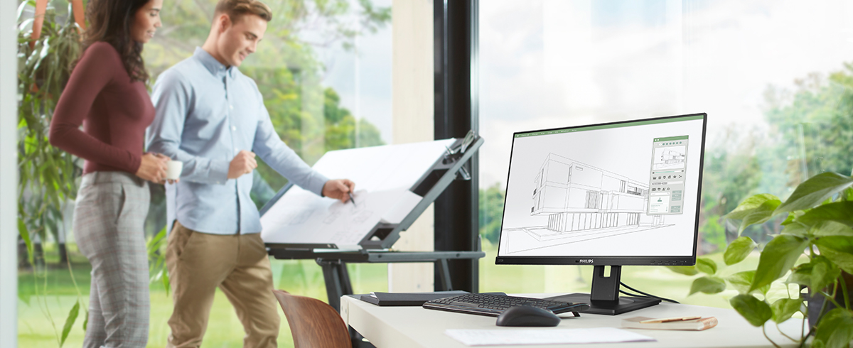 Mensen genieten van de werkplek met Philips groene, milieuvriendelijke monitoren.